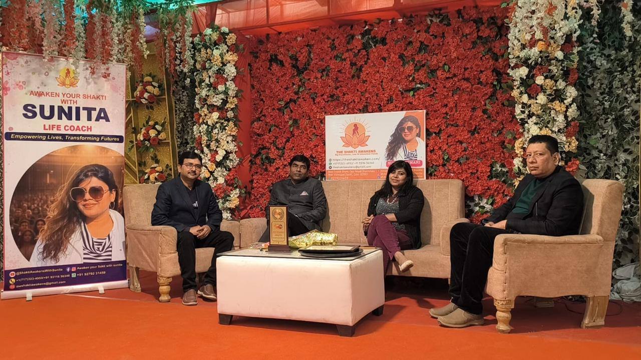 Sunita on a panel discussion stage with three other speakers